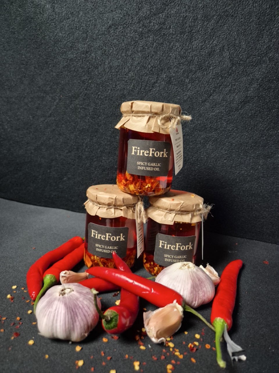 FireFork three jars with peppers and garlics
